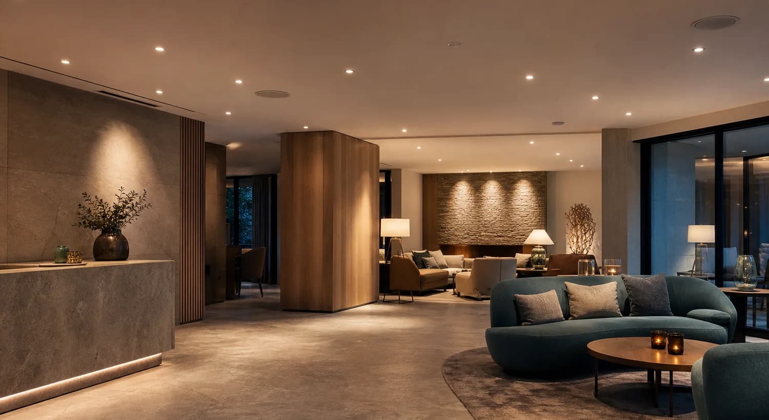 Layered lighting in a hotel lounge and reception environment