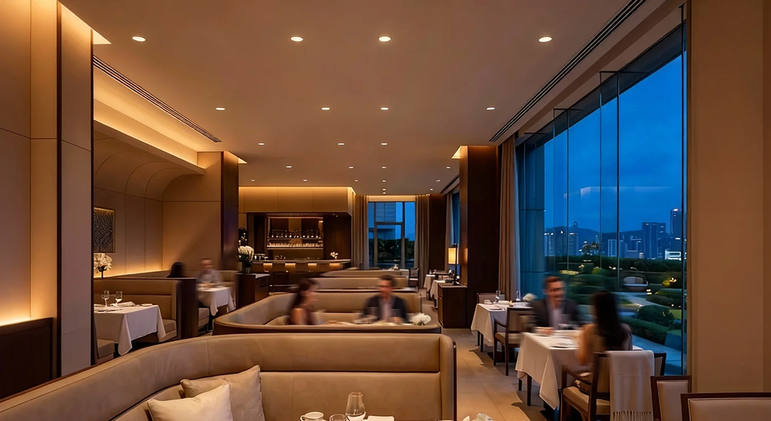 Warm downlighting and concealed lighting in a hotel restaurant