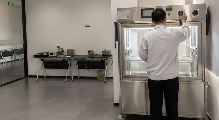 Technician operating waterproof test equipment in the ANOVA lighting laboratory