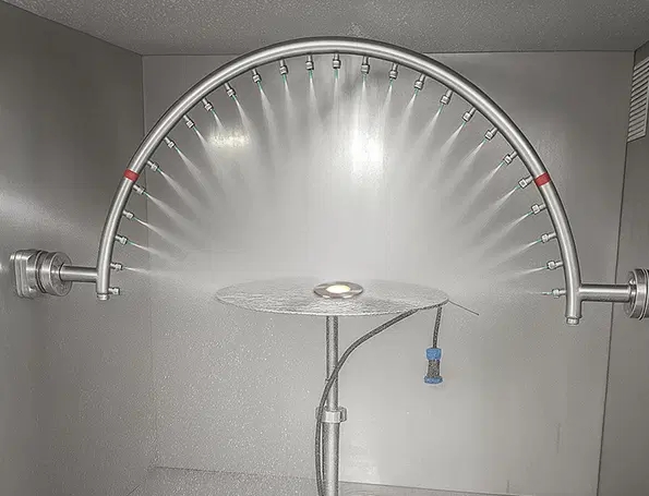 Lighting enclosure undergoing a high-pressure water jet test